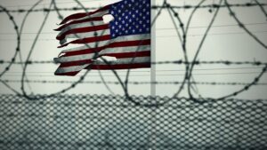 American Flag, torn, barbed wire